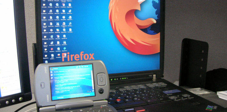 windows phone next to a laptop
